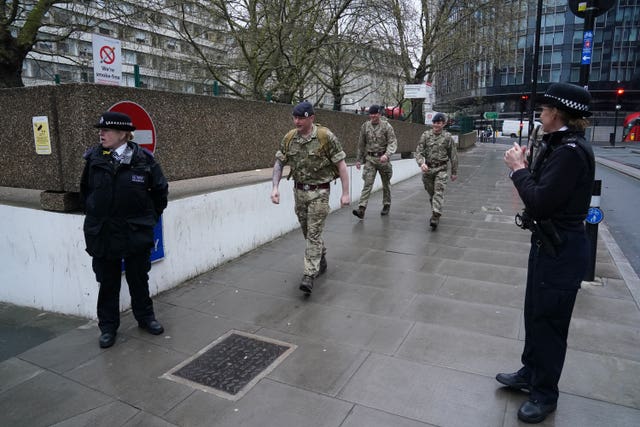 Military personnel and police officers outside St Thomas’ Hospital