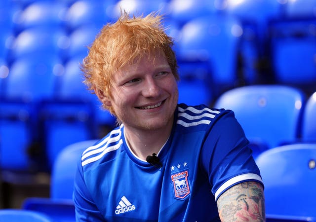 Ed Sheeran in an Ipswich Town shirt