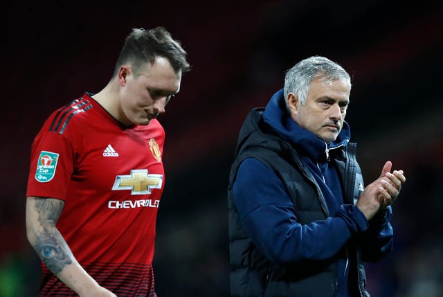 Phil Jones (left) missed the decisive penalty for Jose Mourinho's side (Martin Ricket/PA).