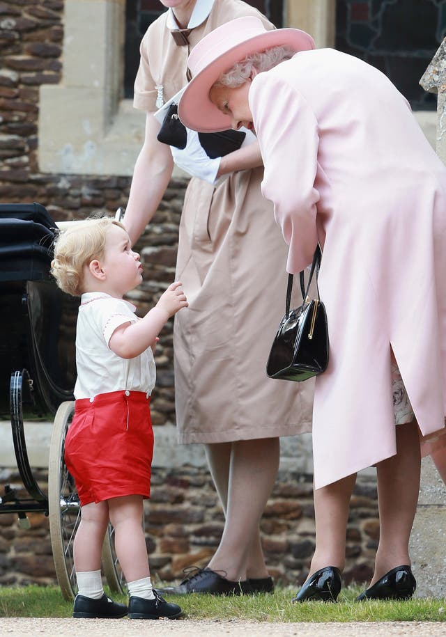 Prince George picks up a few tips on being a monarch from his great-grandmother at Sandringham (Chris Jackson/PA)