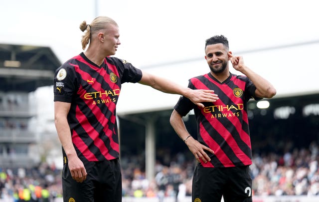 Erling Haaland, left, celebrates his penalty at Fulham which took him to 34 Premier League goals 