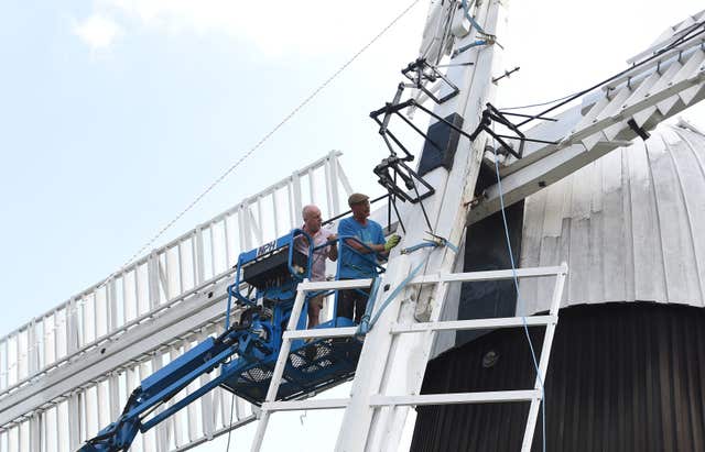 Dan Carrick (left) and millwright Bill Griffiths inspect the clamps and supporting beams (Joe Giddens/PA)