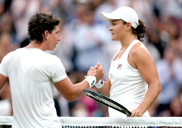 Barty, right, joined in the applause for Carla Suarez Navarro who played for the last time at Wimbledon