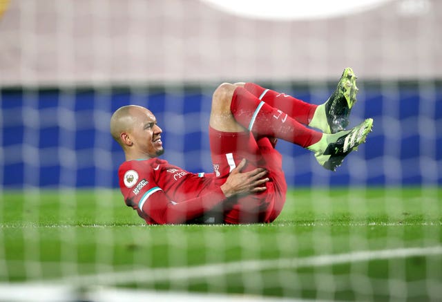 Fabinho lies on the floor holding his hamstring