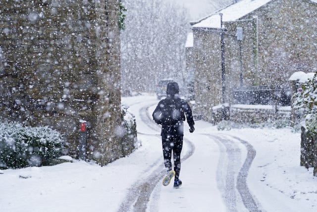 A man runs through the snow