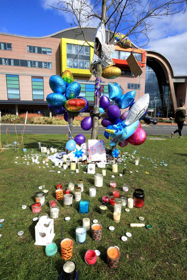Balloons and candles outside Alder Hey Children’s Hospital (John Stillwell/PA)