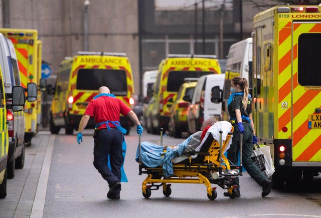 Paramedics unloading a patient from an ambulance outside the Royal London Hospital 