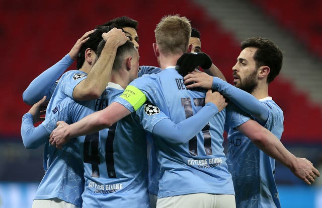 Manchester City's Ilkay Gundogan (left) celebrates scoring during the Champions League match against Borussia Monchengladbach