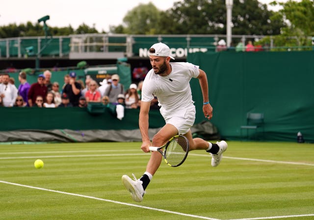Jacob Fearnley runs forward to hit a backhand