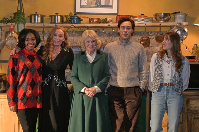 Queen Camilla with Nafessa Williams, Victoria Smurfit, Alex Hassell and Bella Maclean during a visit to the set of the series Rivals in Bristol