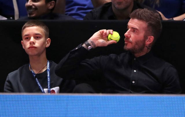 David Beckham (right) and his son Romeo were interested spectators at the O2 