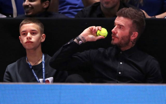 David Beckham (right) and his son Romeo were interested spectators at the O2