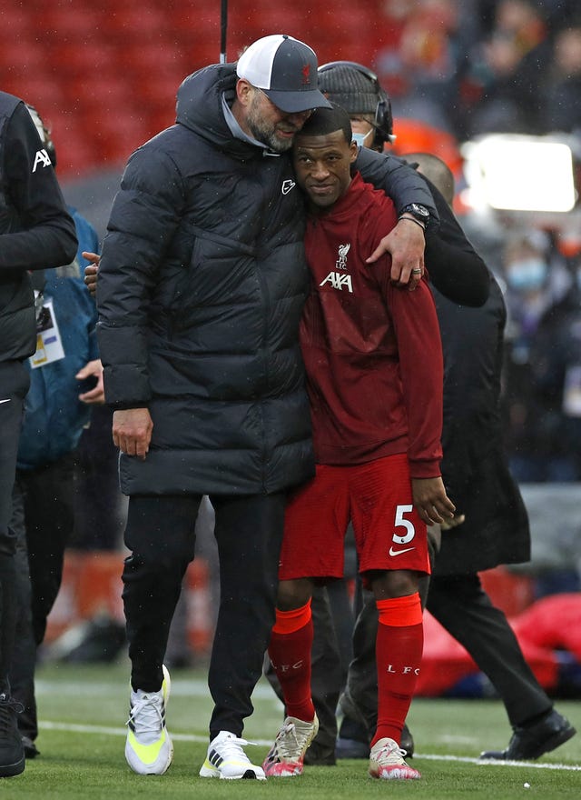 Jurgen Klopp, left, embraces Georginio Wijnaldum after the game