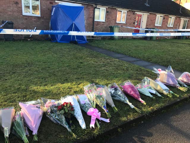 Floral tributes in remembrance of Mylee Billingham outside the property in Brownhills, near Walsall, where the eight-year-old was found with fatal knife wounds (Phil Barnett/PA)