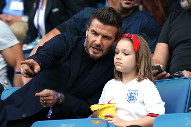 David and Harper Beckham watch England's win over Norway