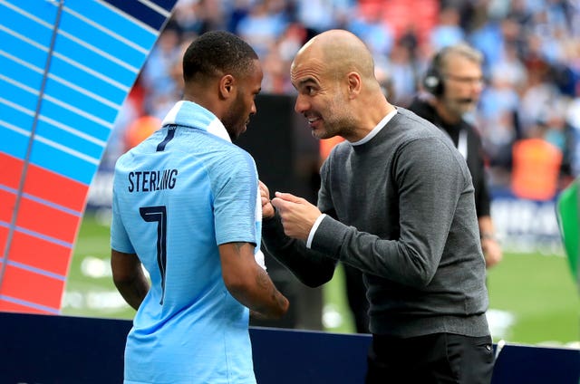 But City manager Pep Guardiola, right, appeared to still have an issue to raise with two-goal forward Raheem Sterling after the game
