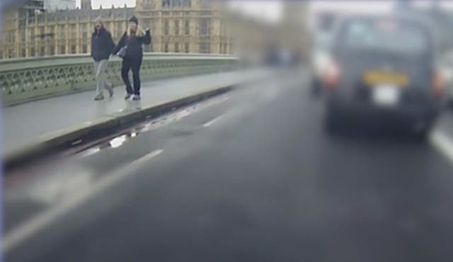 Kurt and Melissa Cochran walk across Westminster Bridge