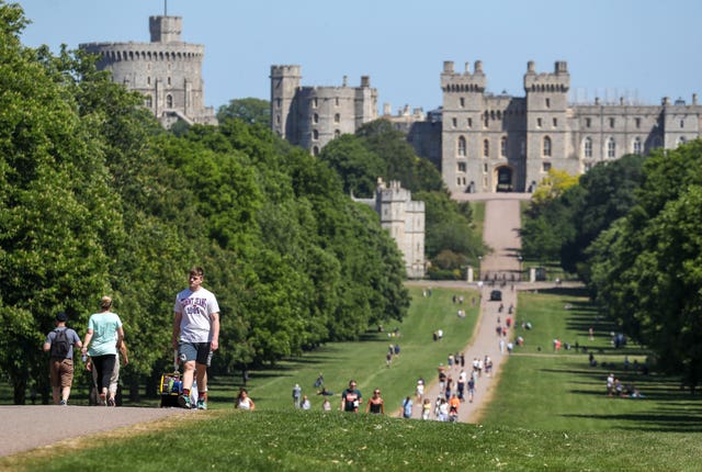 Meanwhile, people enjoyed the hot weather on the Long Walk at Windsor Castle, Berkshire