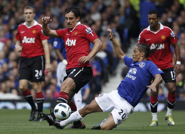 Gary Neville, left, came through the United academy