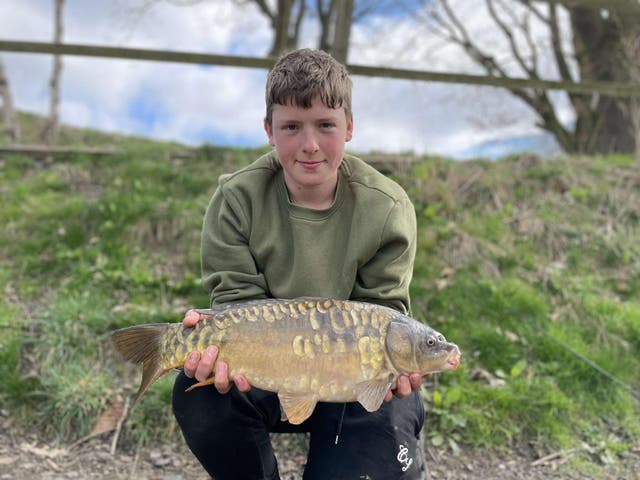 Josh Atkins holding a fish