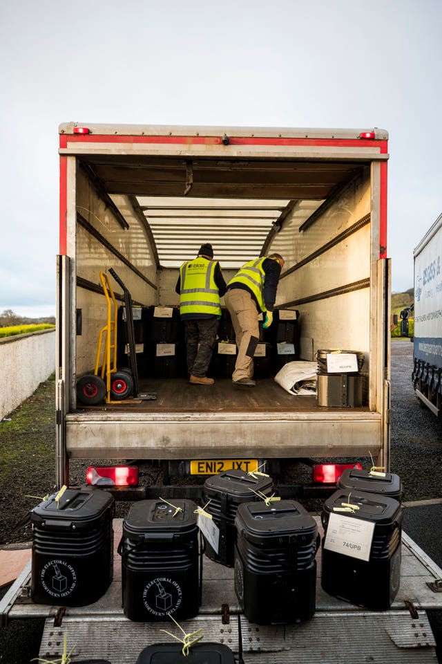 Couriers load election boxes on to a lorry