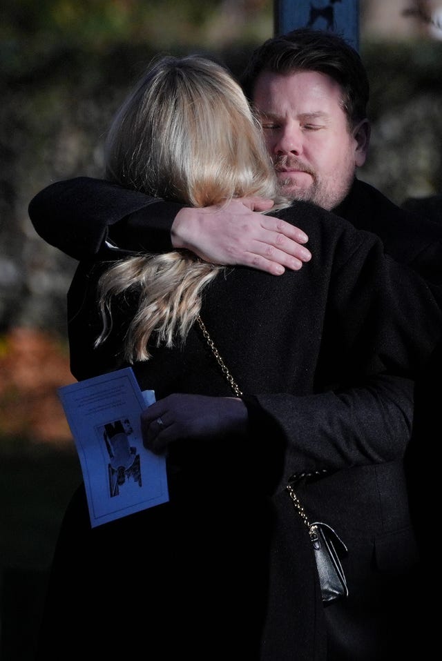 James Corden hugs another guest after the funeral service for One Direction singer Liam Payne