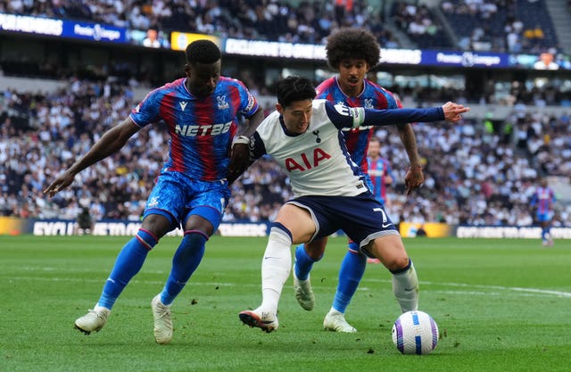 Tottenham’s Son Heung-Min battles for the ball with Crystal Palace’s Marc Guehi (left) and Chris Richards