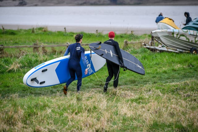 Surfers prepare to surf the first five-star Severn Bore of 2019 at Newnham-on-Severn in Gloucestershire (Ben Birchall/PA)