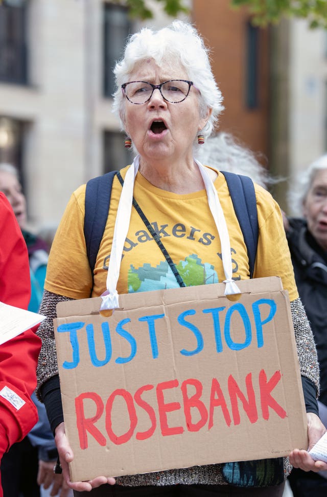 A Stop Rosebank campaigner wears a