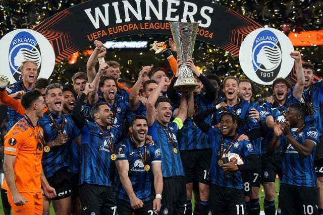 Atalanta captain Berat Djimsiti and team-mates celebrate with the Europa League trophy