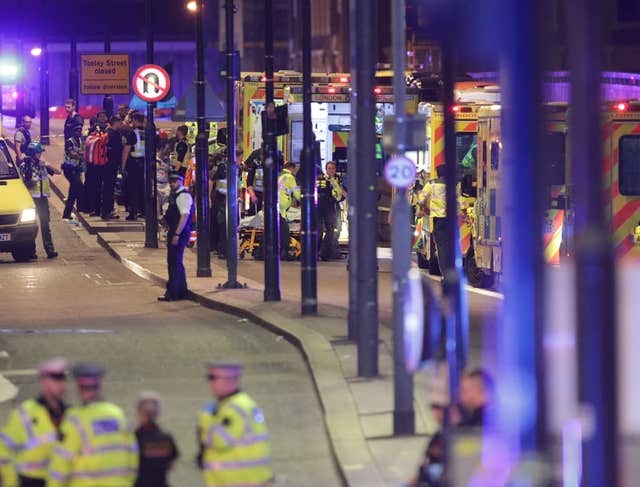 Emergency personnel tending to the wounded on London Bridge in the aftermath of the attack last year