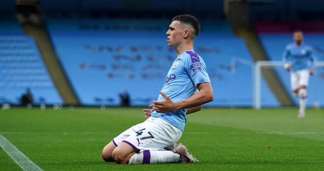 Manchester City’s Phil Foden celebrates after scoring his side’s third goal against Liverpool