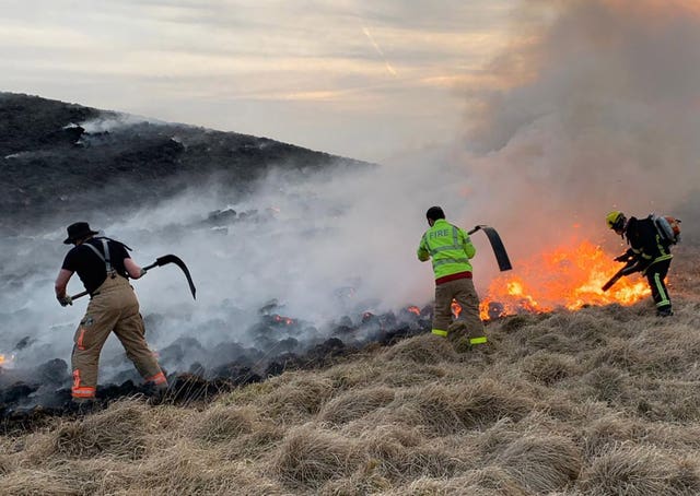 Firefighters at work in Lyme Park 