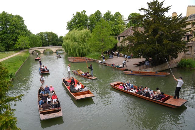 People punting along the River Cam in Cambridge