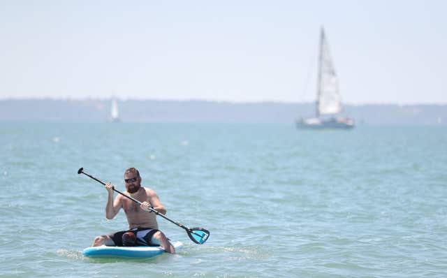 A man paddleboarding