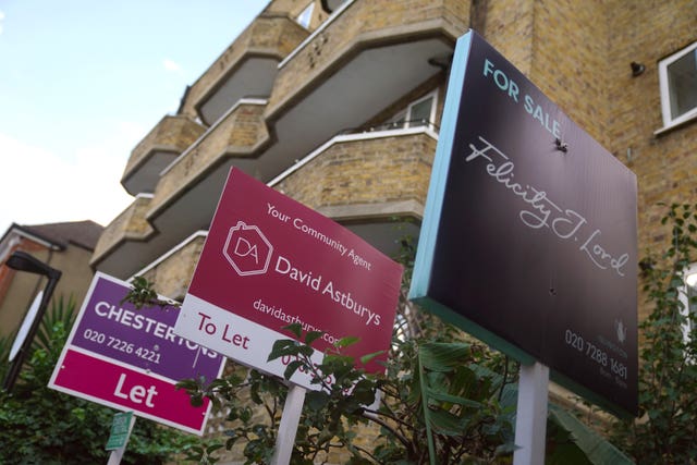 To let and for sale signs outside a block of flats