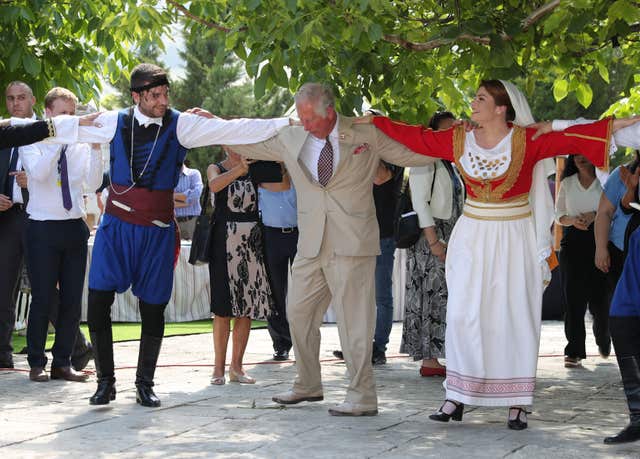 Before the royal couple had a go at Greek dancing in Archanes. Here's the Prince of Wales... (Andrew Matthews/PA)