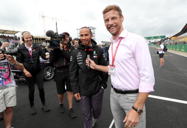 Jenson Button (right) questioned Ferrari's tactics
