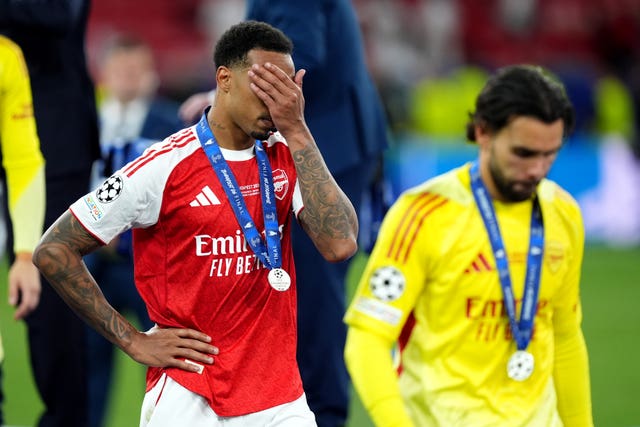 Arsenal’s Gabriel, left, and David Raya look dejected following last season's Champions League final defeat