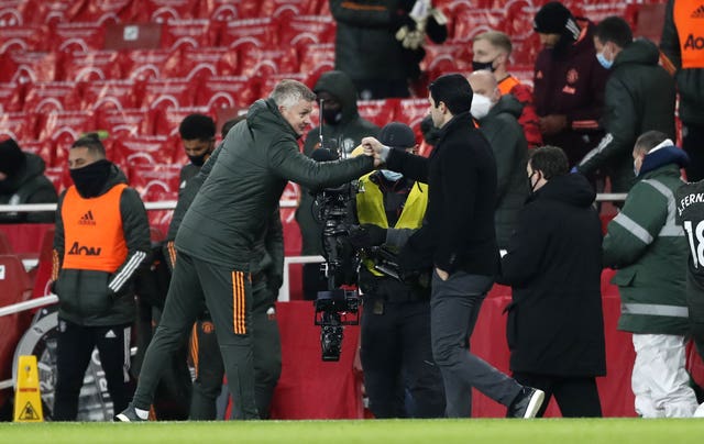 Manchester United manager Ole Gunnar Solskjaer and Arsenal manager Mikel Arteta fist bump 