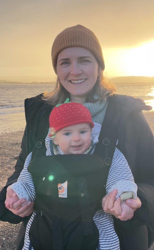 Hannah Robinson holding their child
