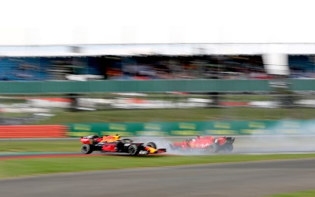 Ferrari's Sebastian Vettel and Red Bull's Max Verstappen collide, an incident from which the Dutchman recovered to race on