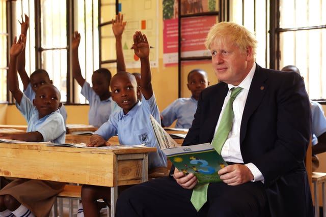 Mr Johnson read to students (Dan Kitwood/PA)