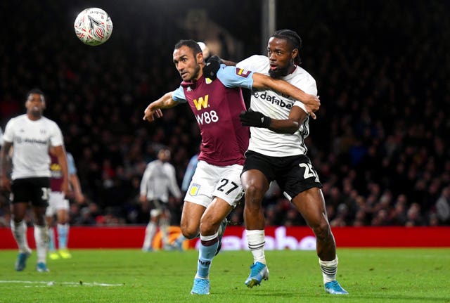 Aston Villa’s Ahmed Elmohamady, left, and Fulham’s Josh Onomah battle for the ball