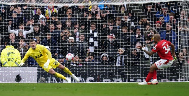 Fraser Forster saves a late penalty from Andre Ayew