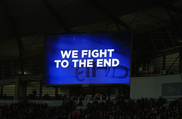City show their defiance on the big screen during their derby defeat at the Etihad Stadium