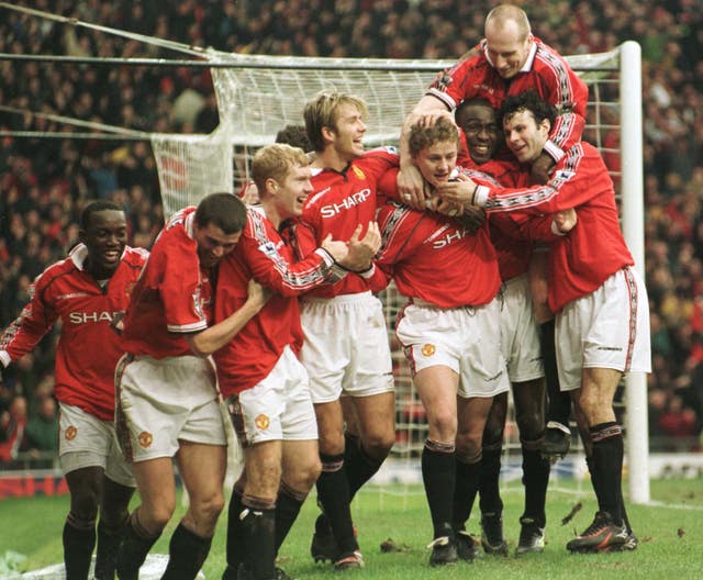 Ole Gunnar Solskjaer is mobbed by his team-mates after his goal on January 24, 1999