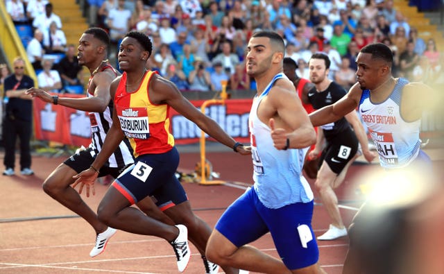 Ojie Edoburun, second left, wins the 100m at the British Championships