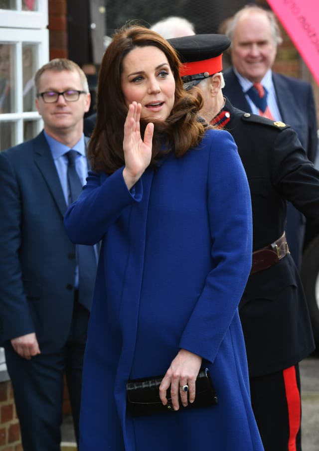 The Duchess of Cambridge waves at the crowd as she arrives to open the Action on Addiction treatment centre (John Stillwell/PA)