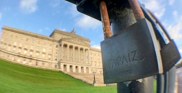 A padlock on a railing outside Stormont